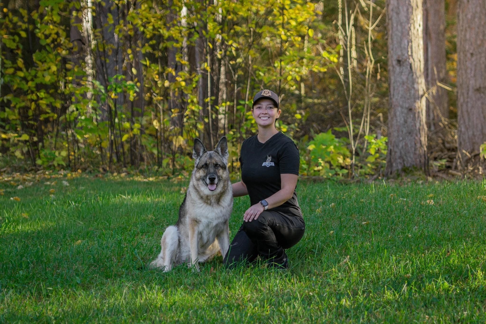 Trainer working one-on-one with a dog outdoors